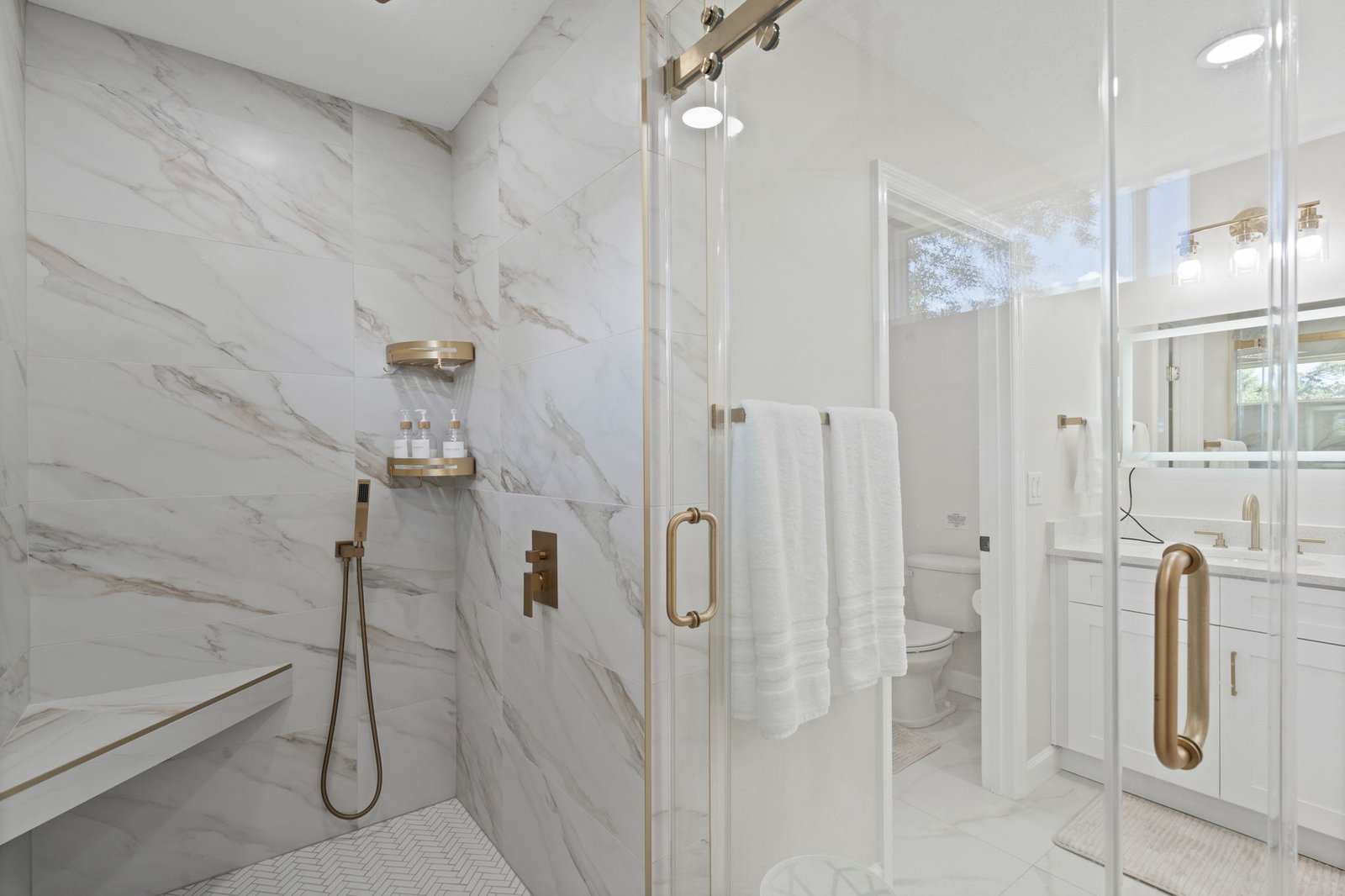 Bright bathroom with marble shower in a Home Haven vacation rental